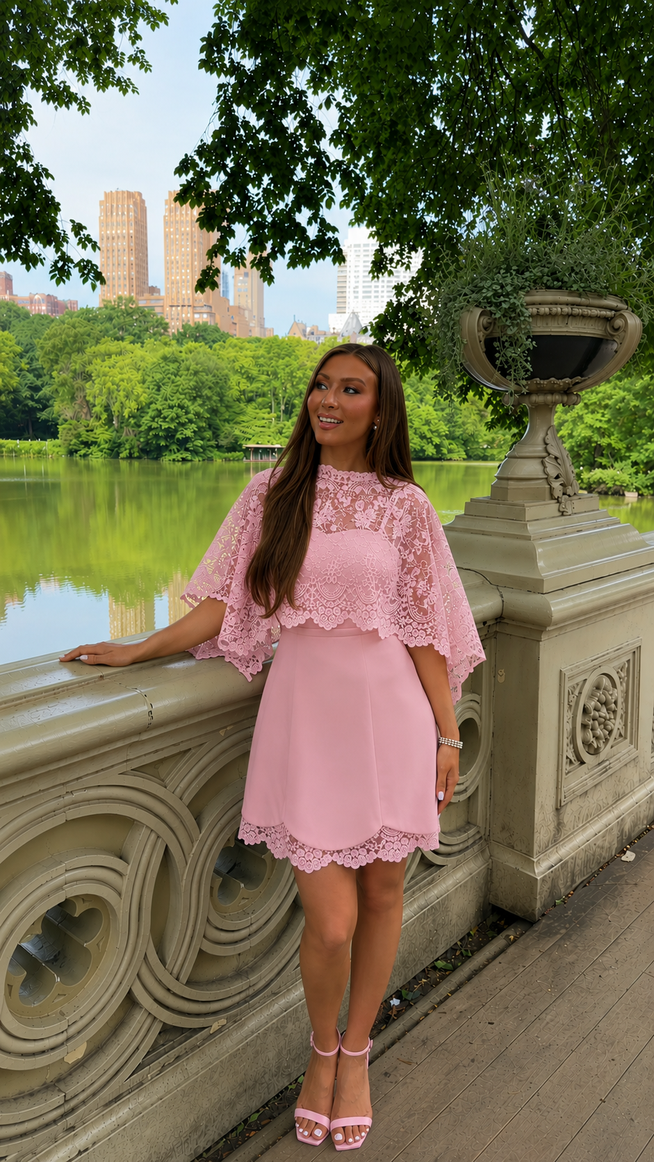 Front view of blush pink lace overlay mini dress with cape sleeves