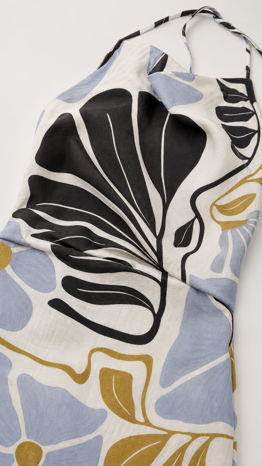 Close-up of fabric texture and abstract floral pattern on white background