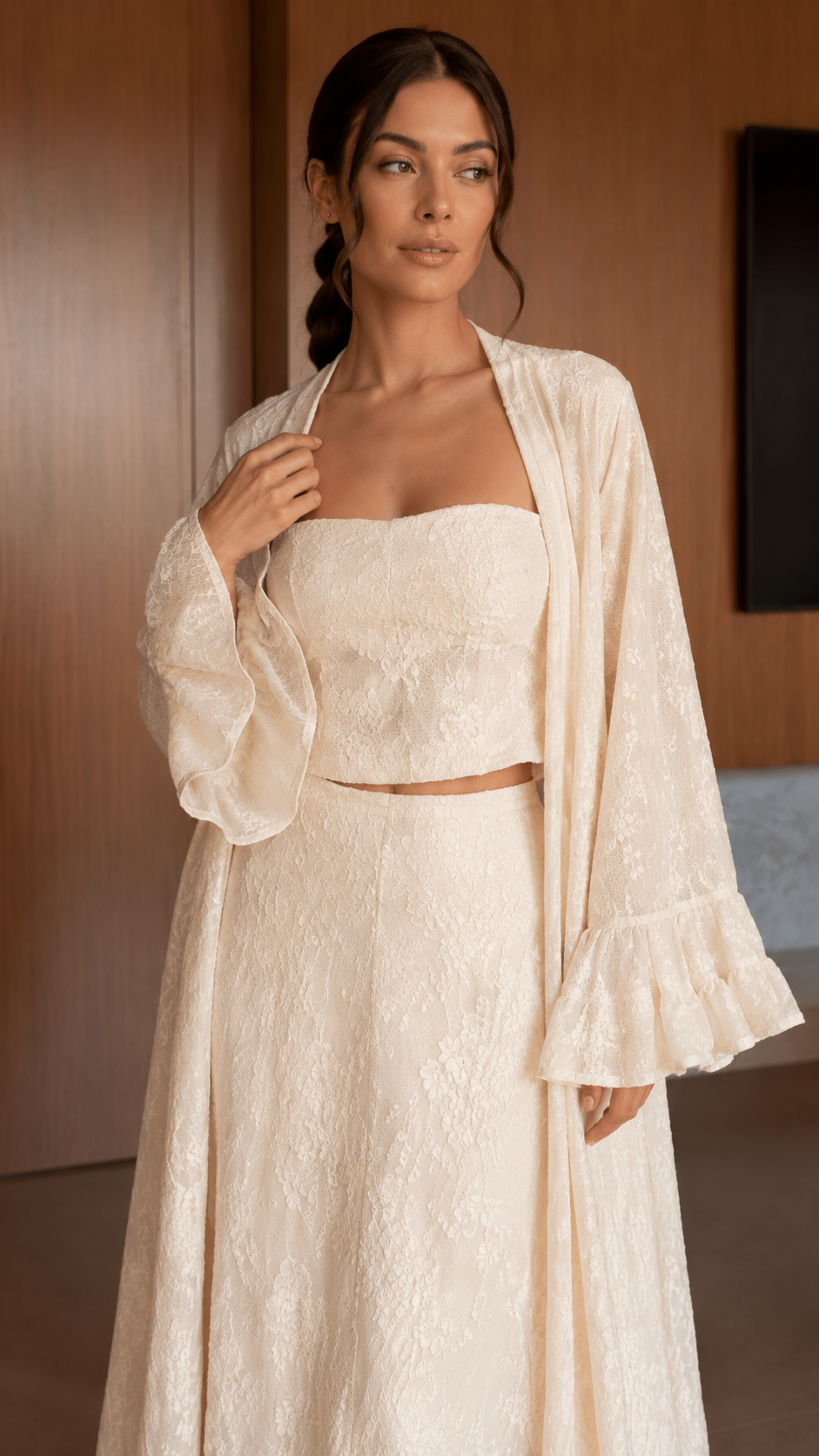 Close-up of ivory square-neck crop top and textured midi skirt with long duster