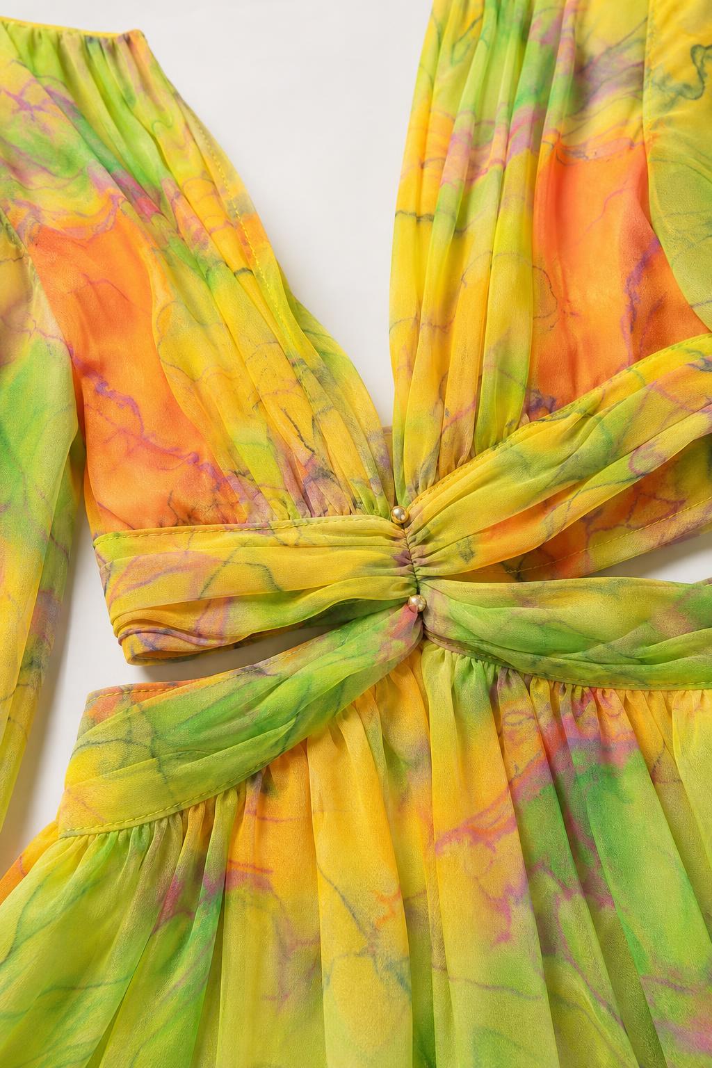 Close-up detail of plunging V-neckline and waist cutouts