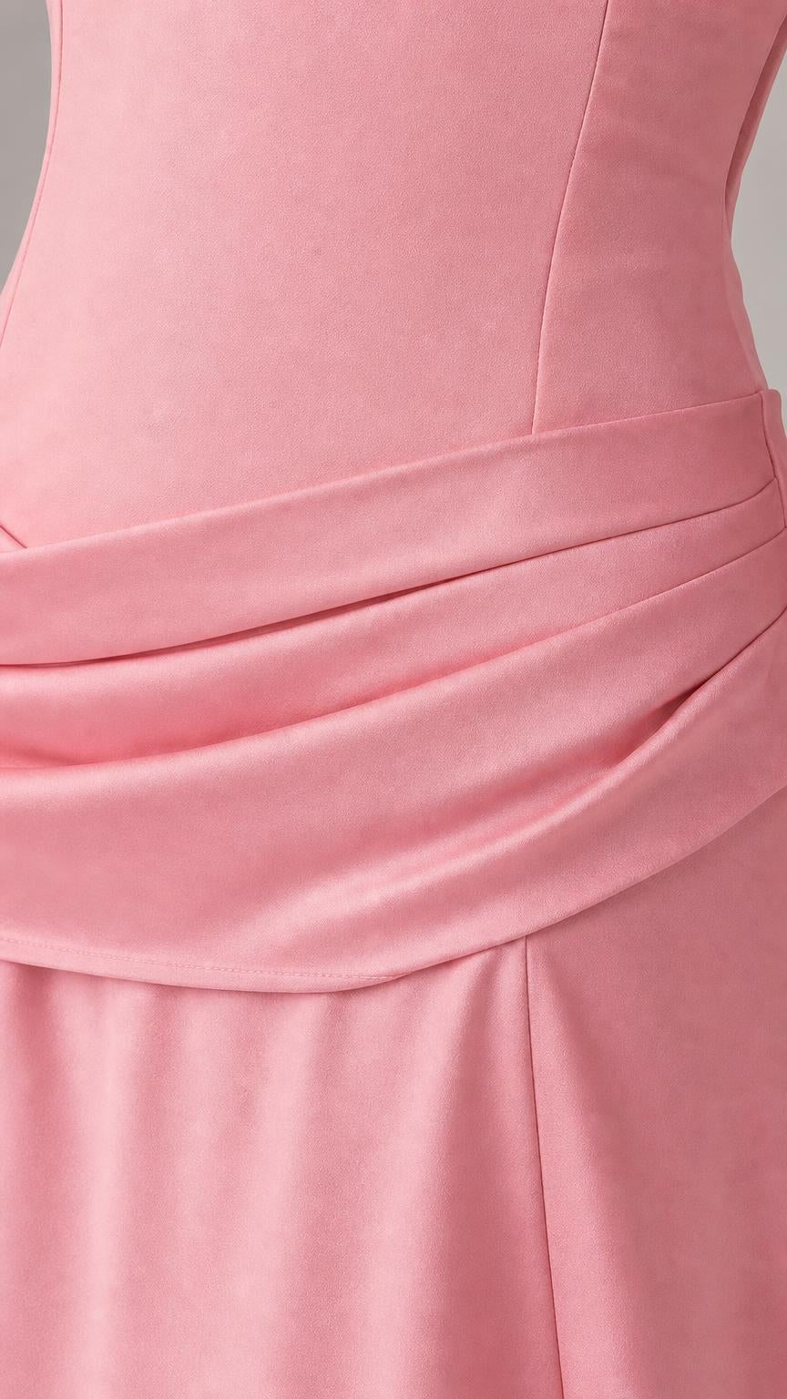 Close-up detail of draped drop-waist on pink dress