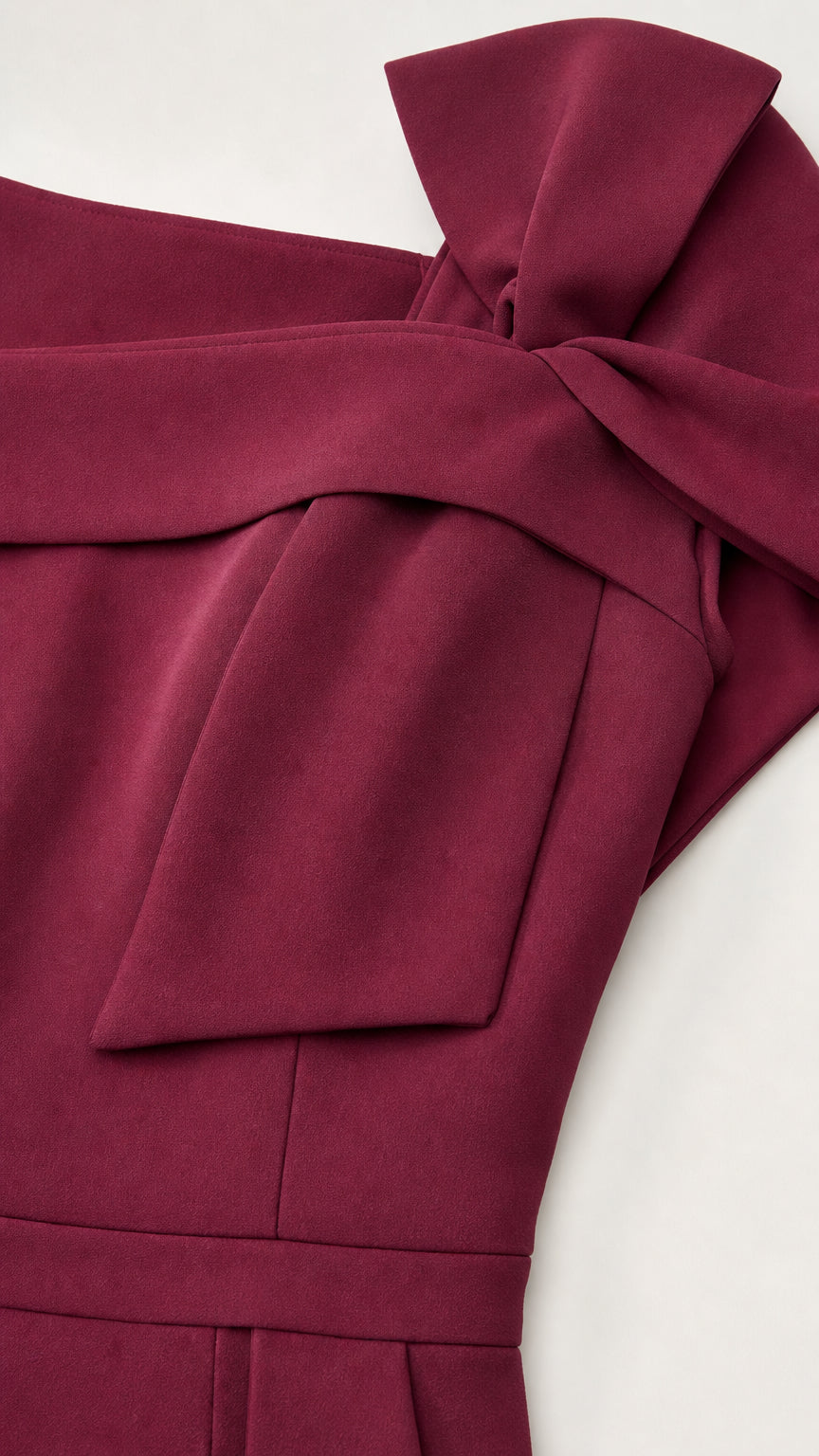 Close-up detail of shoulder bow and neckline