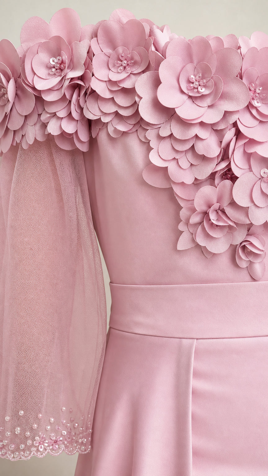 Close-up of 3D floral appliques and sheer sleeve