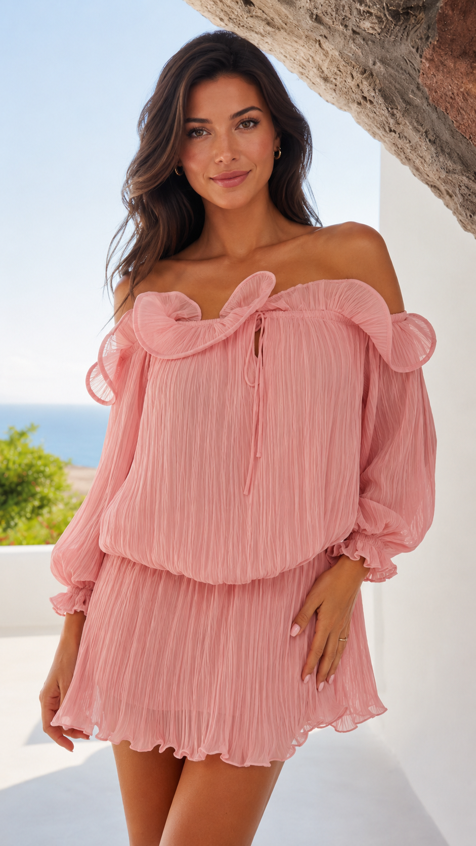 Close-up of blush pink off shoulder ruffle neckline pleated mini dress