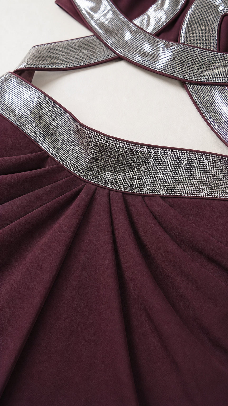 Close up of shimmering silver strap and ruched waistband detail