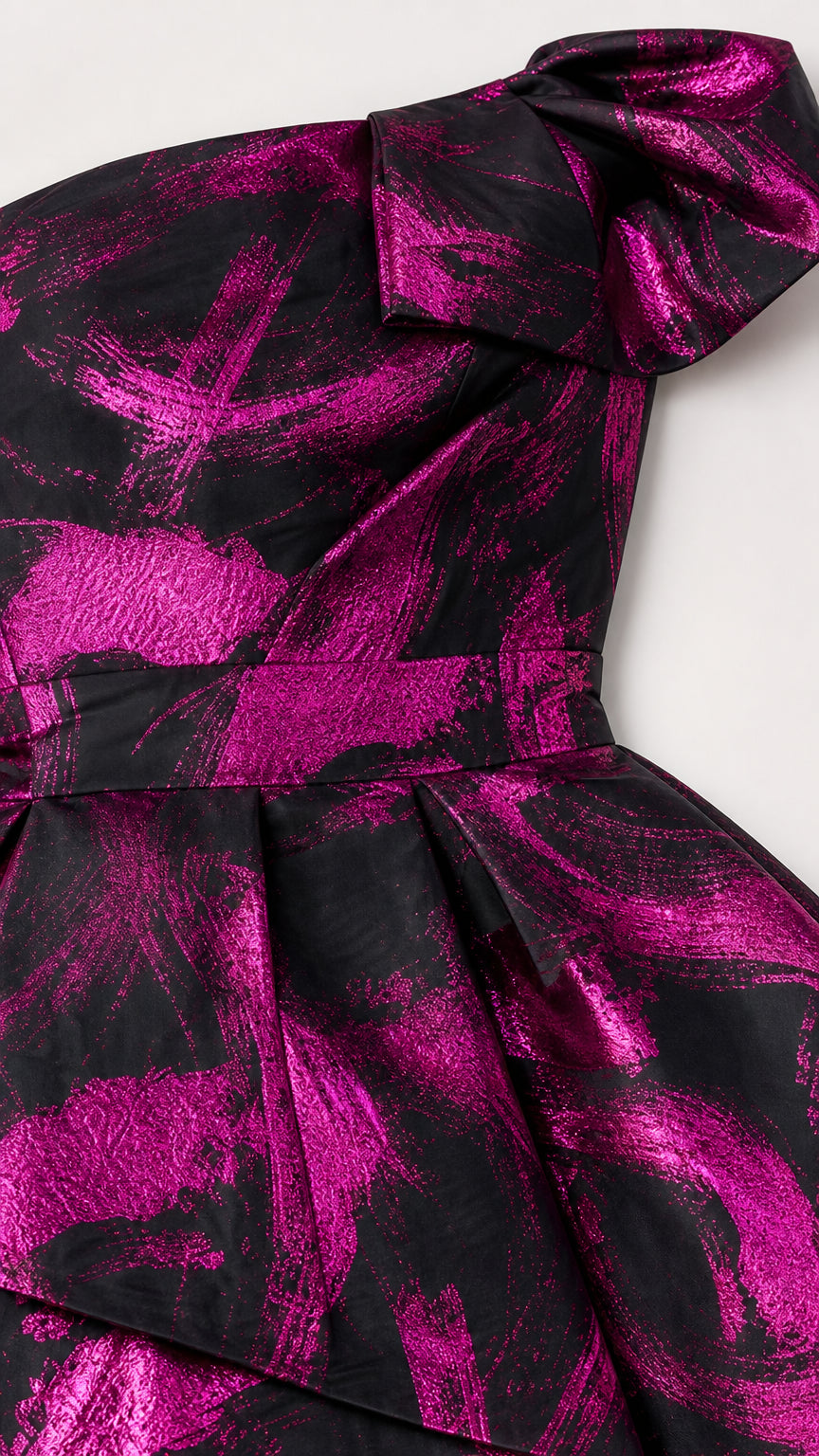 Close-up detail of shoulder bow and bodice on fuchsia evening dress