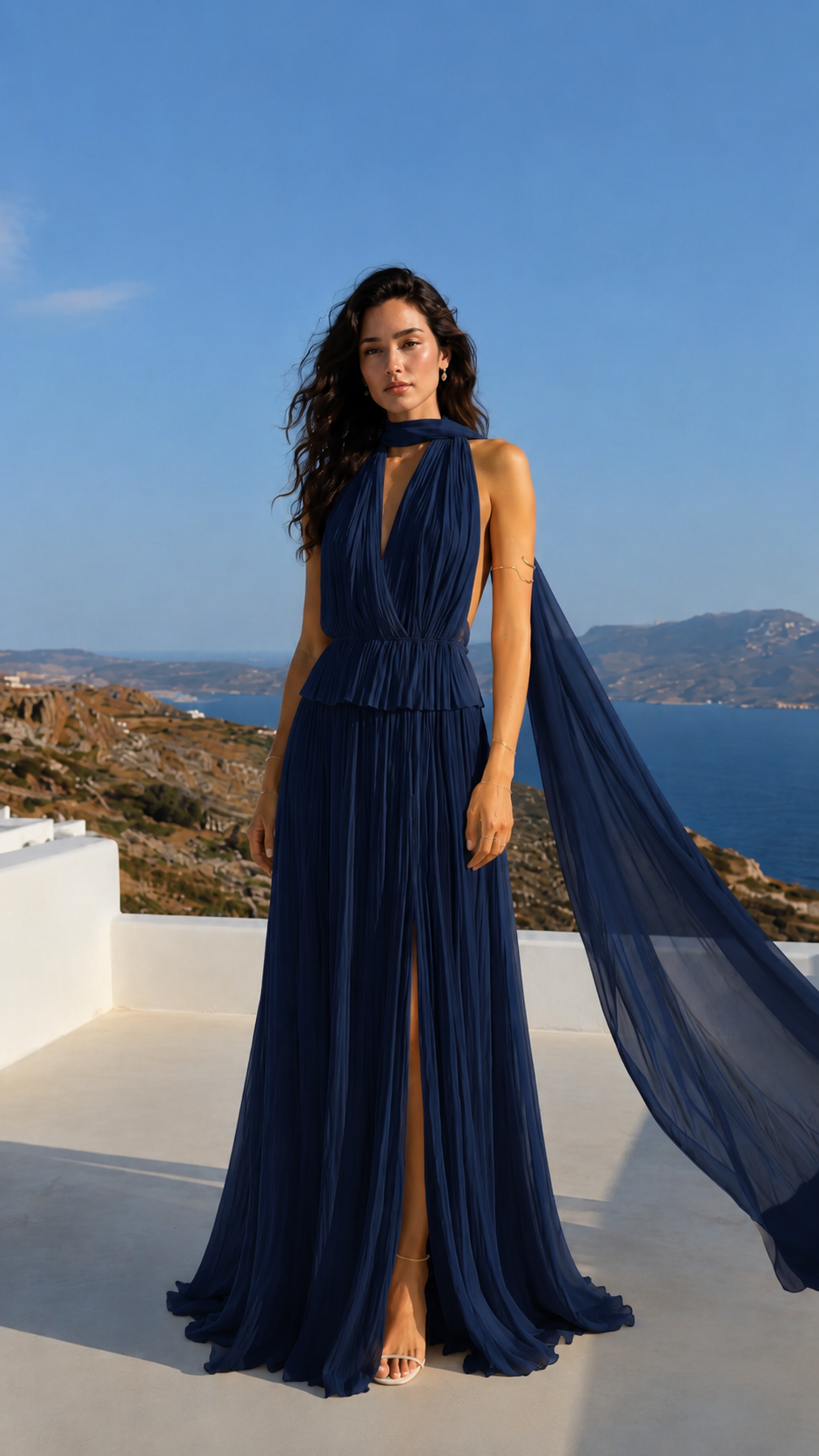 Front view of navy pleated halter maxi dress with keyhole neckline and flowing scarf