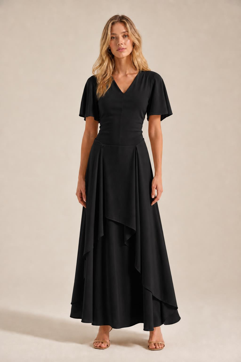 Front view of model wearing black V-neck flutter sleeve maxi dress