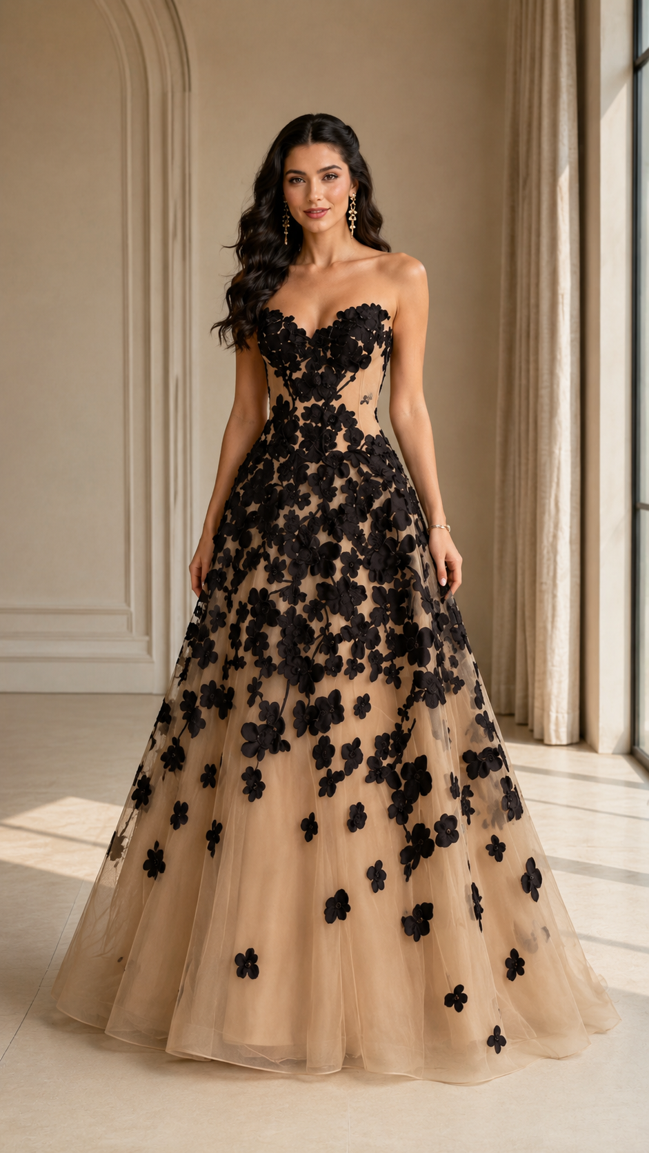 Front view of black floral appliqué strapless A-line formal gown with nude base