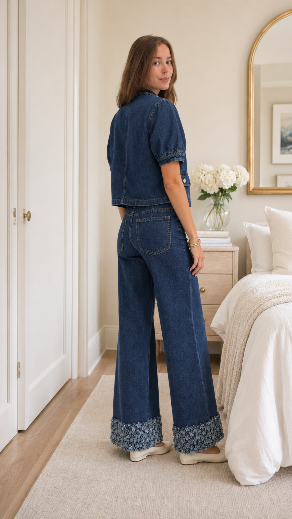 Back view of dark wash blue denim wide leg pants set with floral trim hems