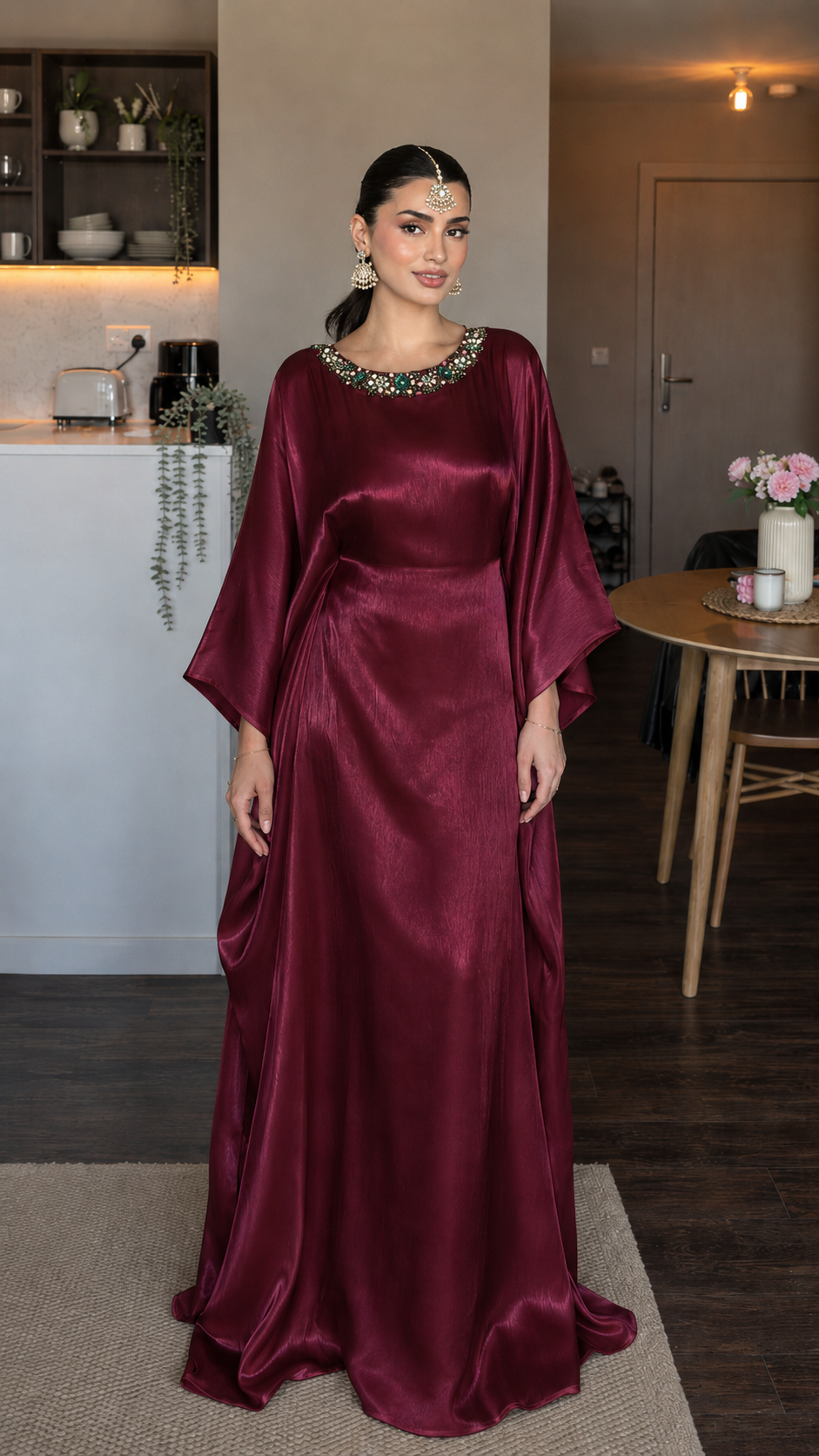 Front view of burgundy satin-look maxi dress with flowing silhouette and jeweled collar detail