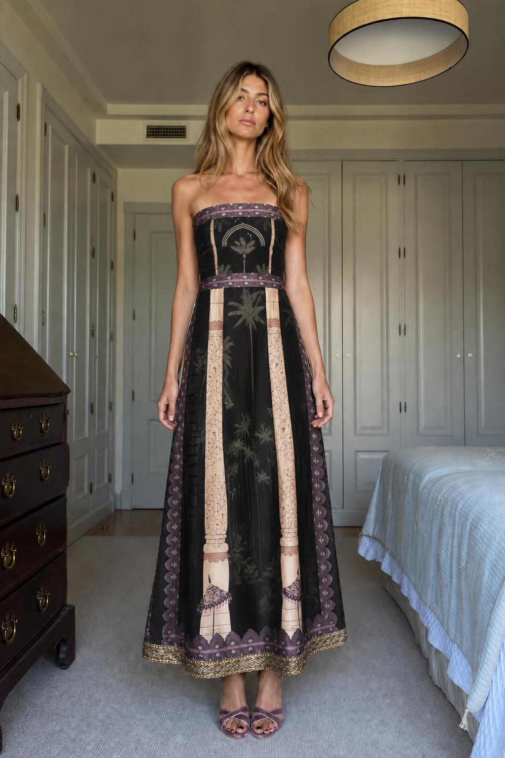 Model wearing Black strapless maxi dress