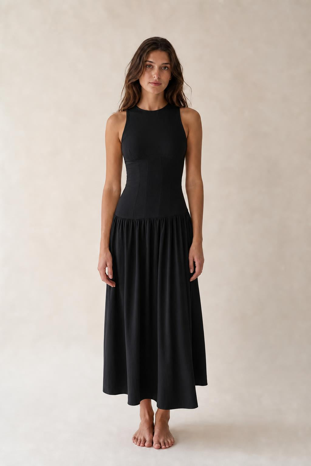 Front view of woman wearing Black sleeveless midi dress