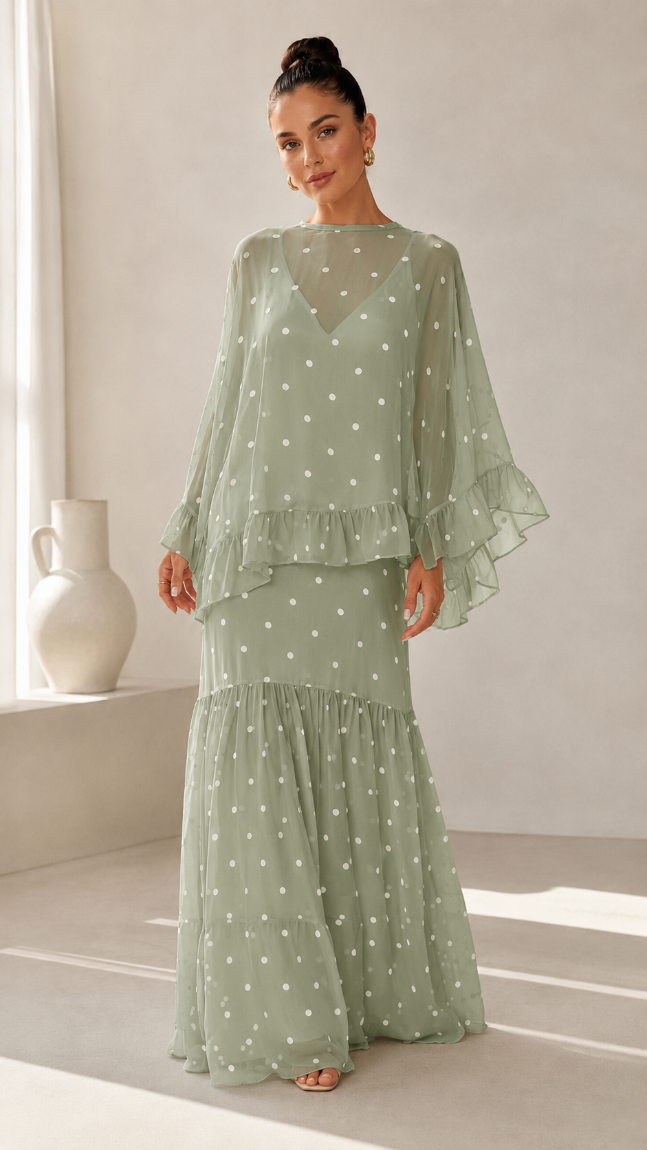 Sage green polka dot maxi dress with sheer draped sleeves and ruffle skirt