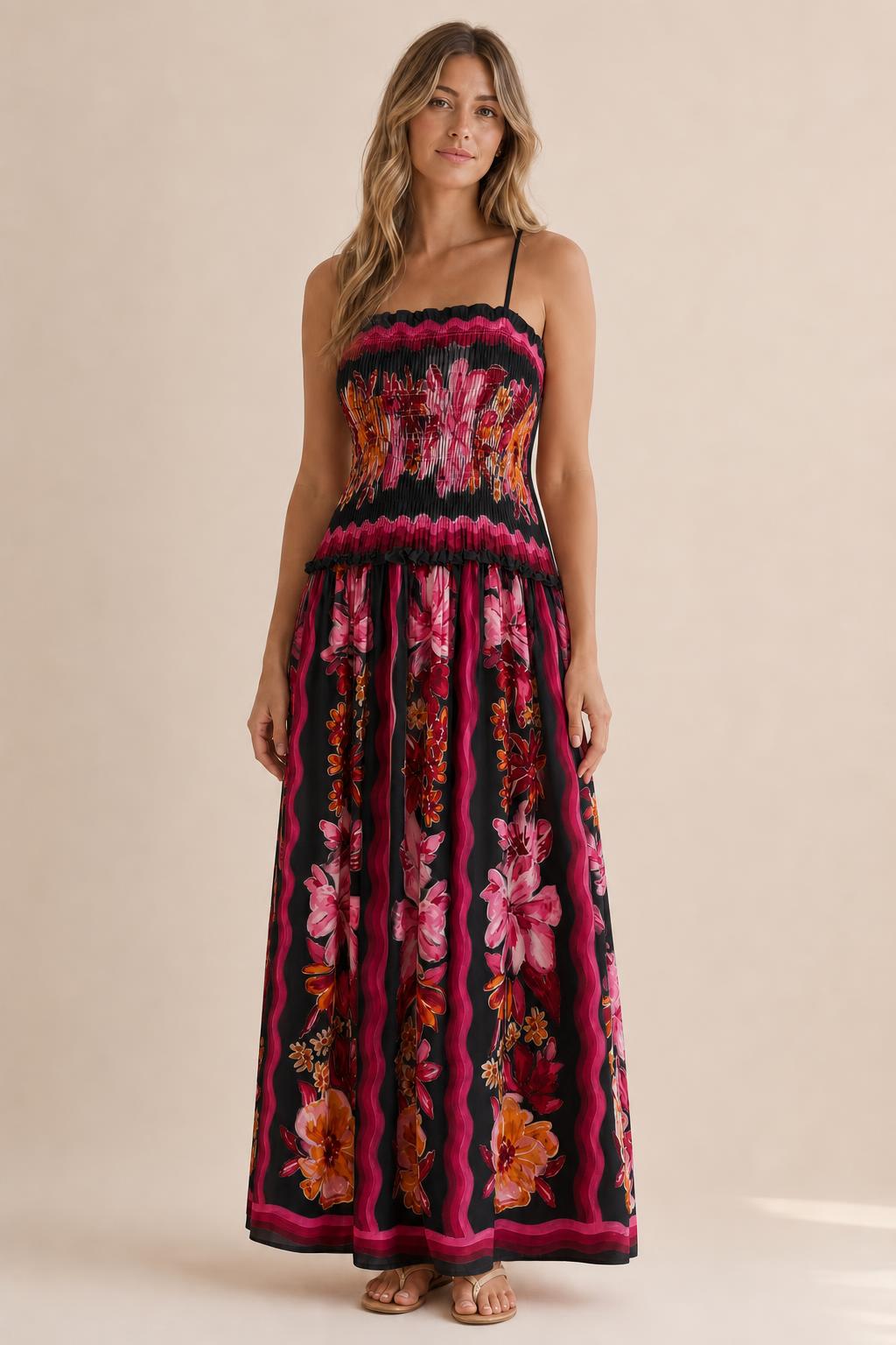 Front view of floral print smocked maxi dress in black