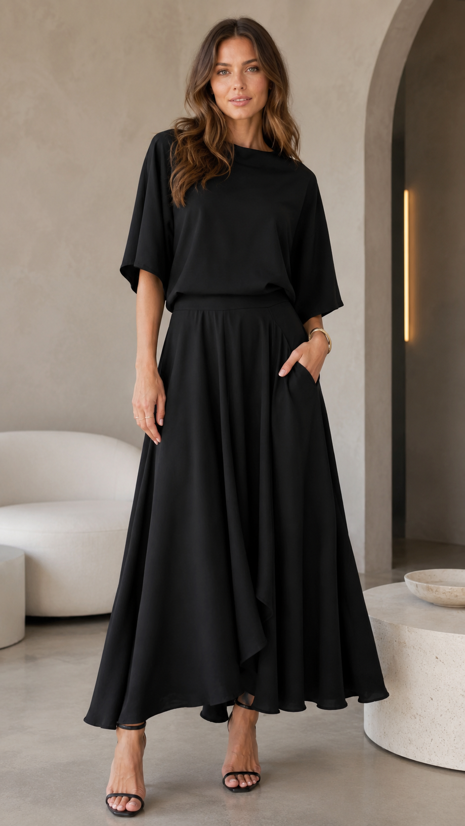 Black belted A-line dress with pockets and flowing midi maxi skirt