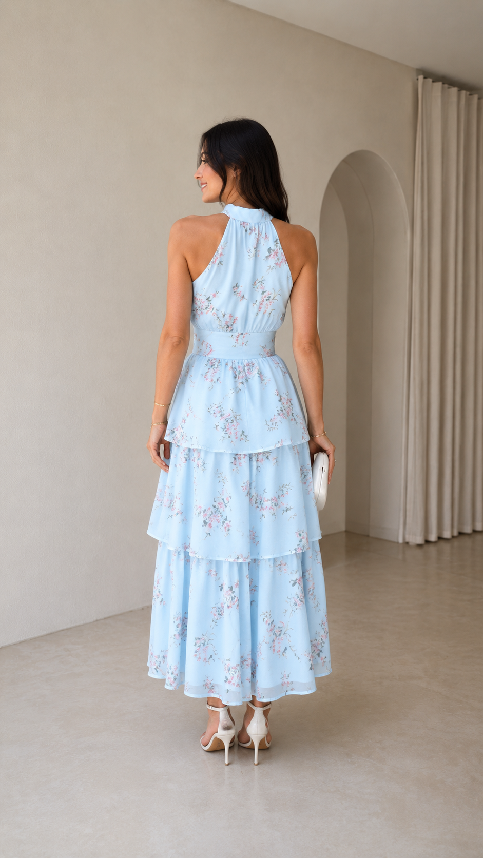 Sky blue floral halter tiered maxi dress shown from the back