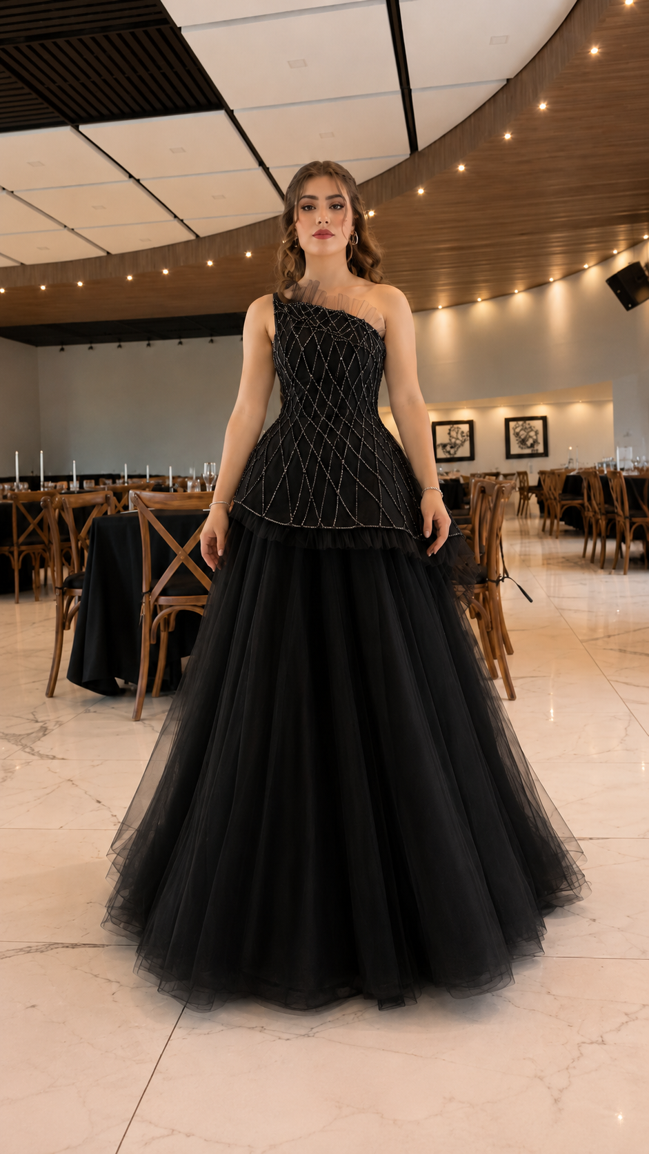 Front view of black one-shoulder beaded tulle ball gown
