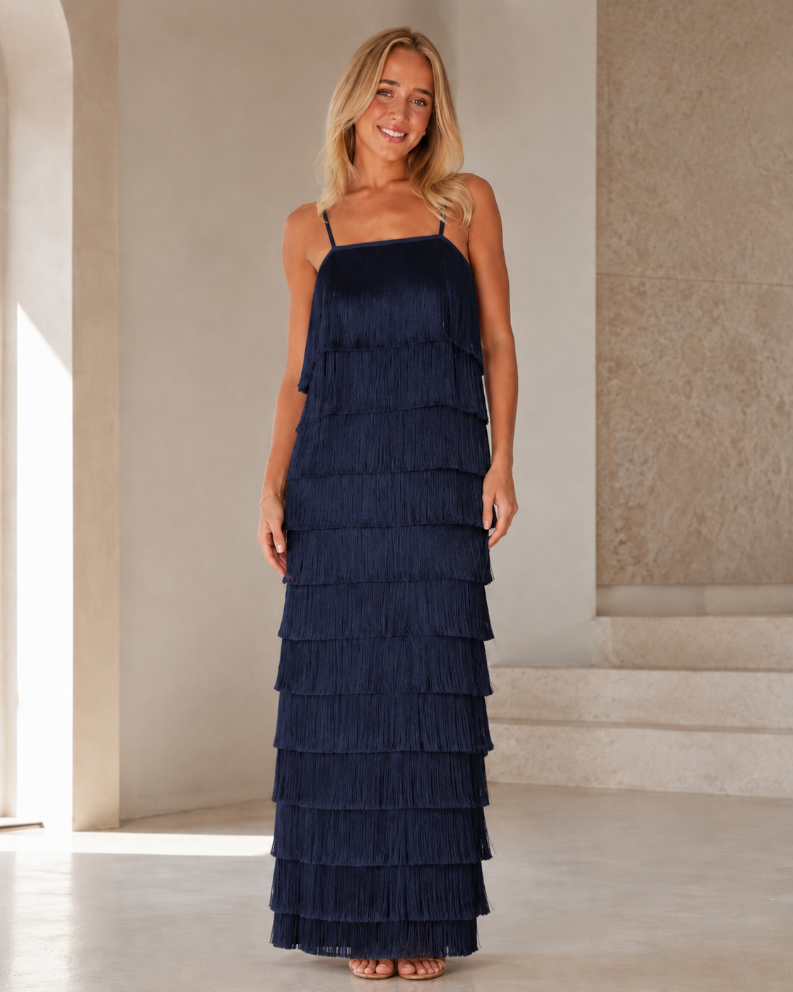 Full front view of navy tiered fringe maxi dress with layered texture