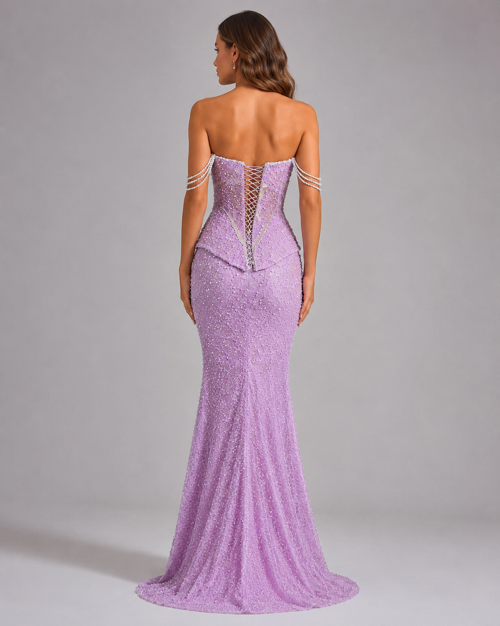 Back view of lilac mermaid evening gown with lace-up corset detail