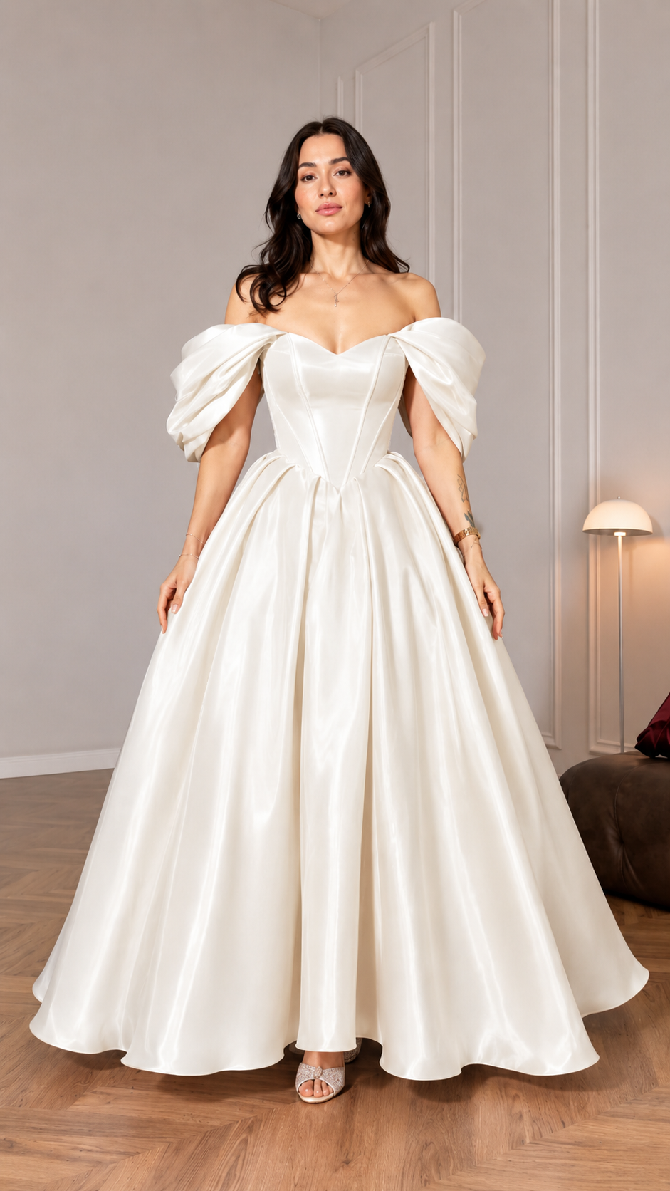 Front view of ivory off shoulder formal gown with puff sleeves and sweeping hem