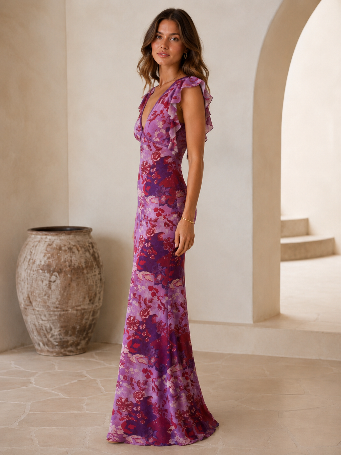 Side view of purple floral body-skimming maxi dress with ruffle sleeves