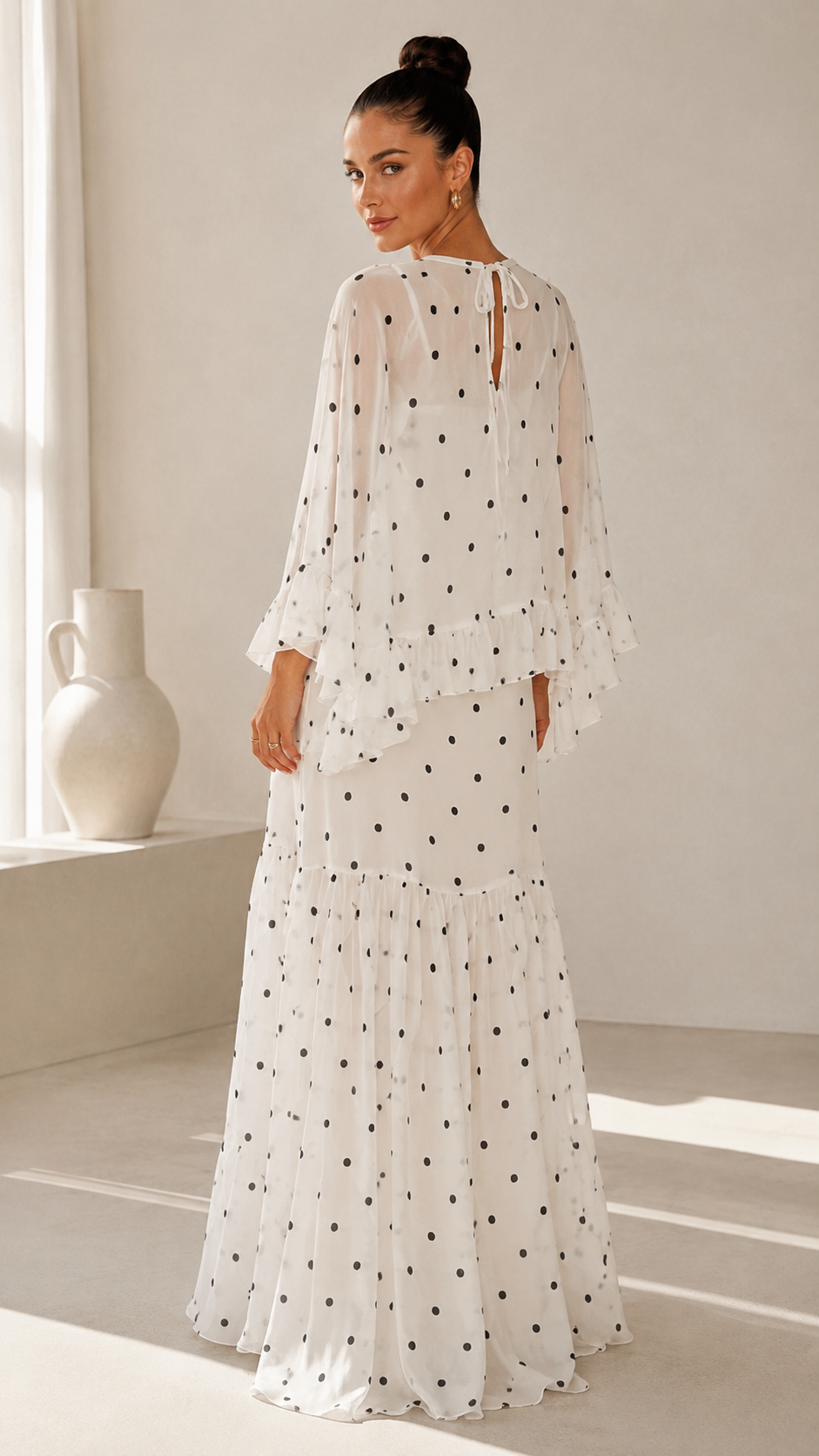 Back view of white polka dot maxi dress with keyhole tie neckline