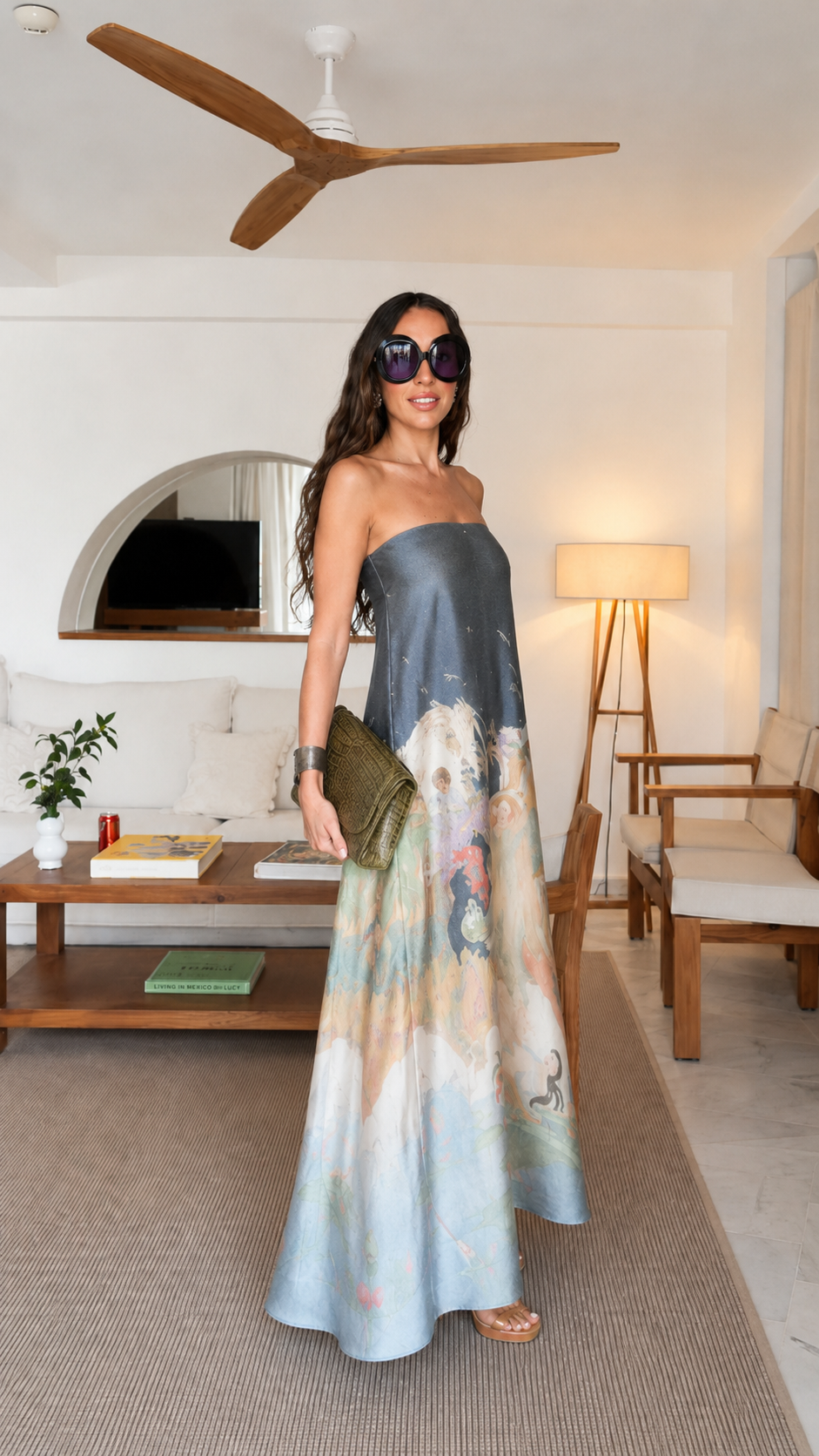 Side view of slate blue strapless flowing maxi dress