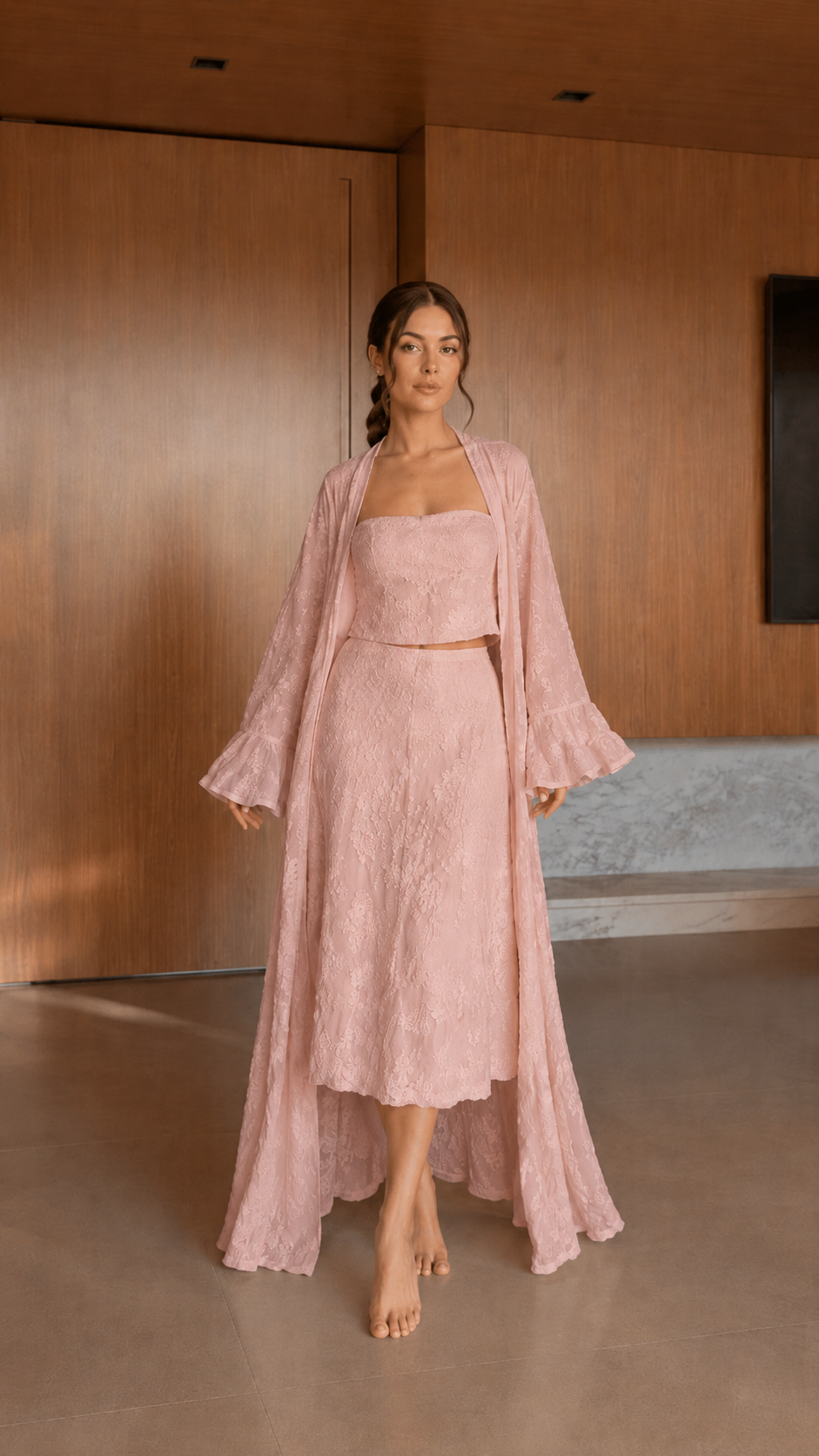 Front view of blush pink textured 3-piece skirt set with midi skirt