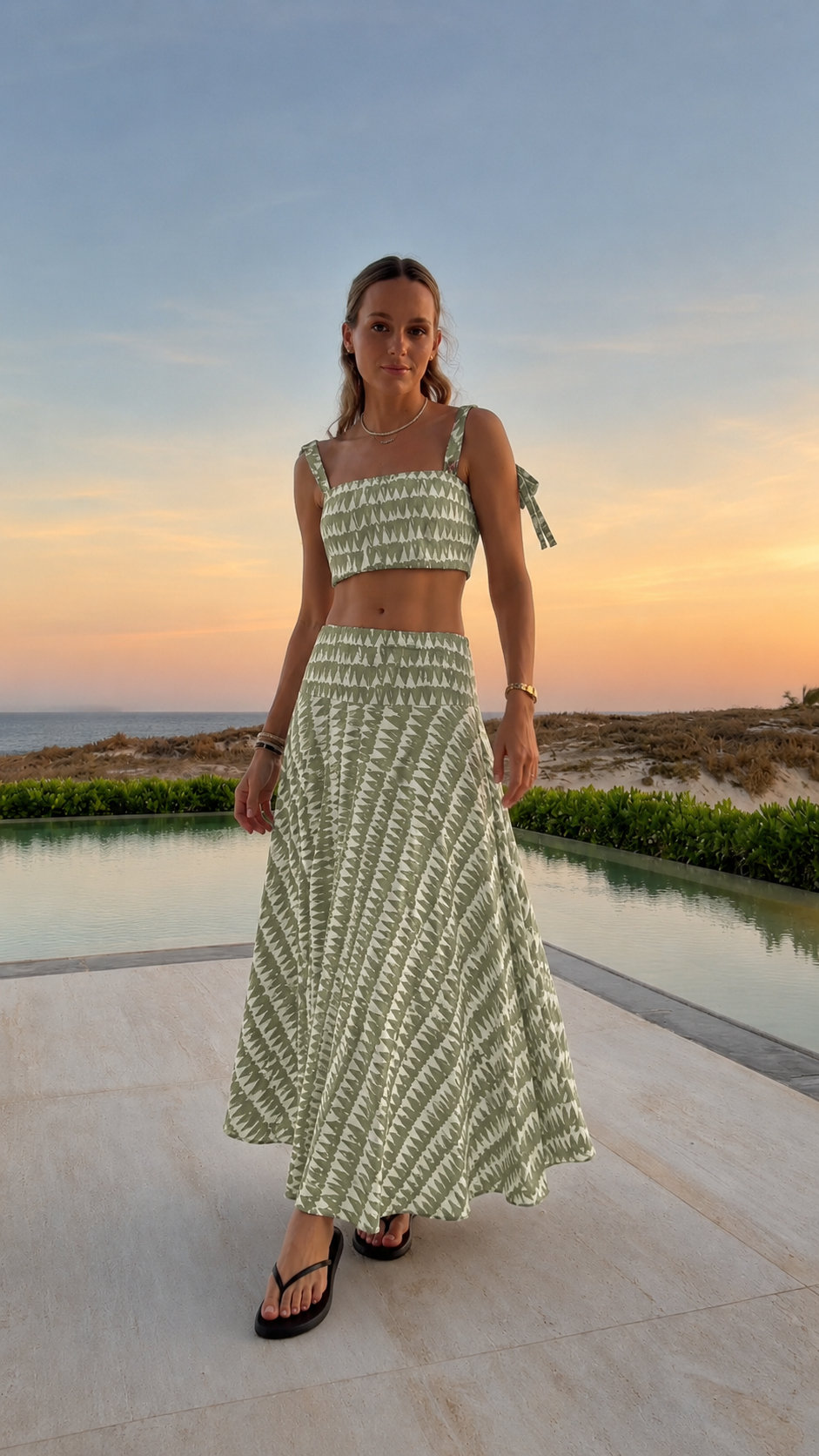 Front view of sage printed smocked crop top and maxi skirt set