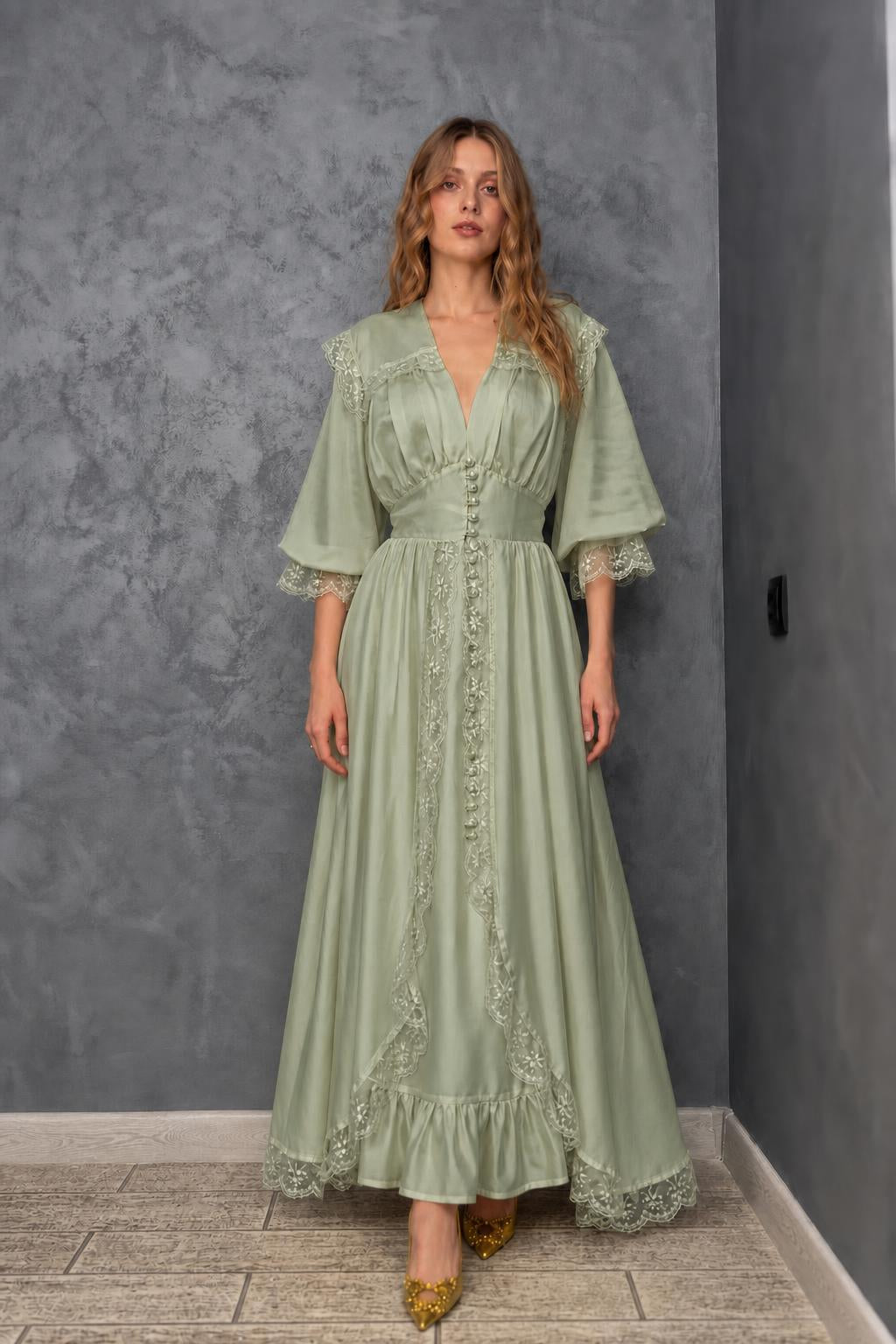 Model wearing sage green vintage lace maxi dress