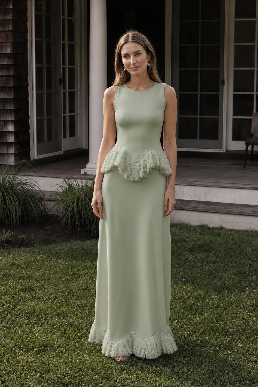 Front view of model wearing sage fringed peplum maxi dress