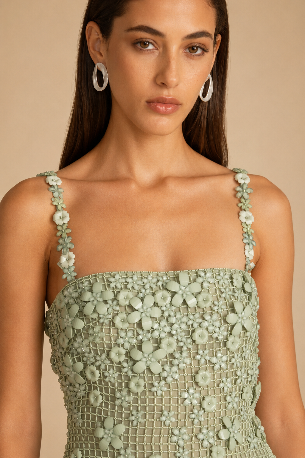 Close-up of sage floral appliqué neckline and straps