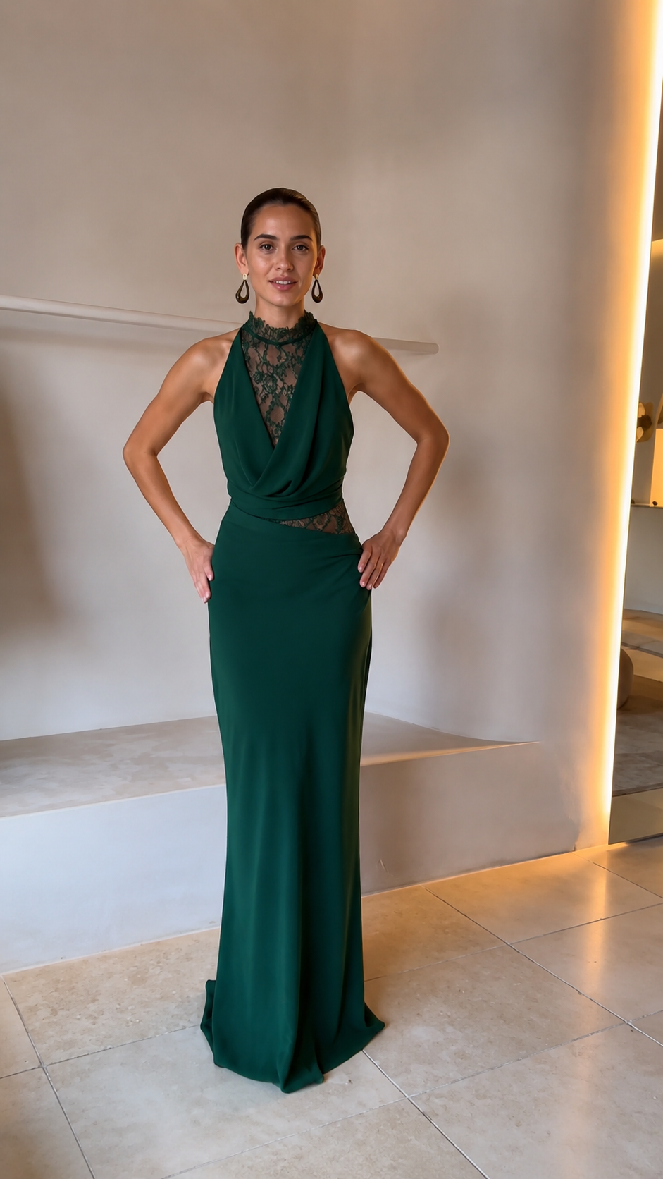 Front view of emerald green halter lace evening gown with slim fit