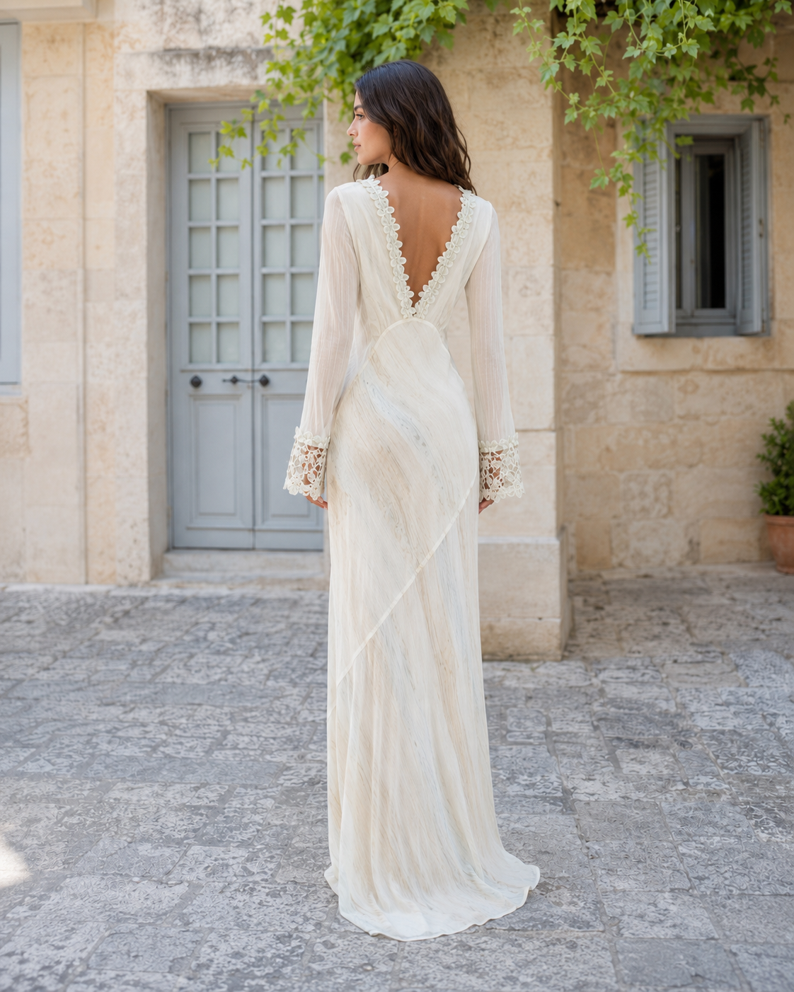Back view of ivory maxi dress with low V back and lace trim detail