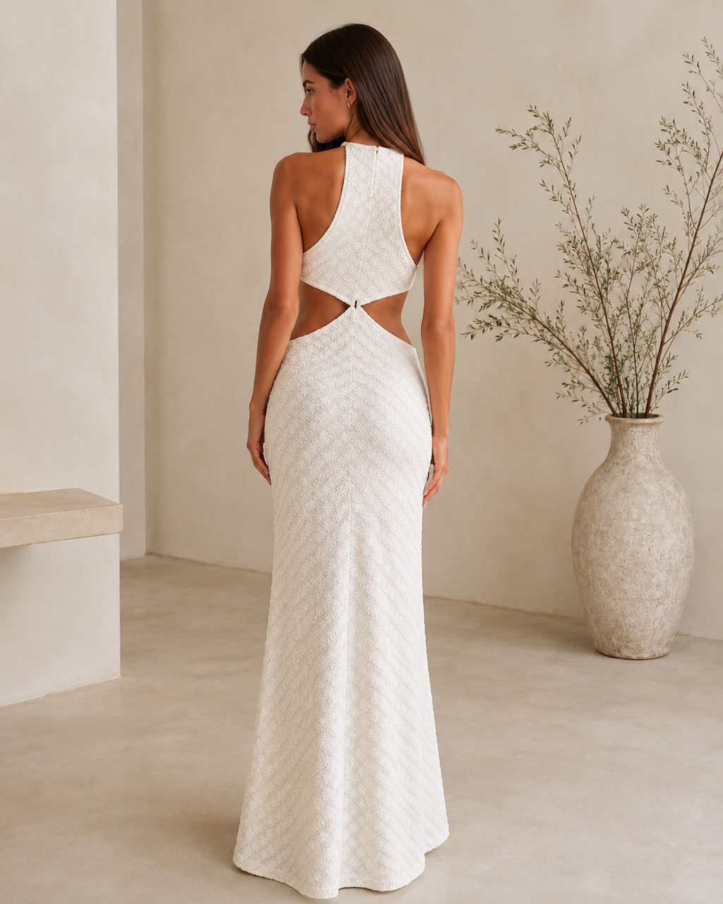 Back view of white textured halter cutout maxi dress