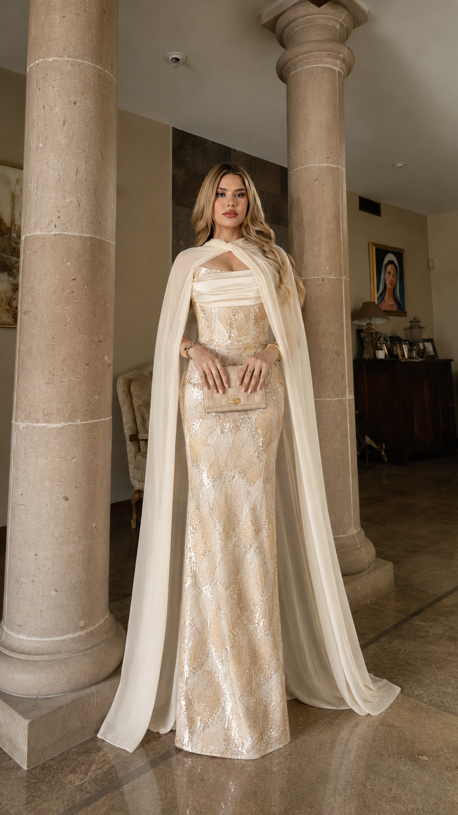 Champagne sequined evening gown with floor-length cape and fitted silhouette