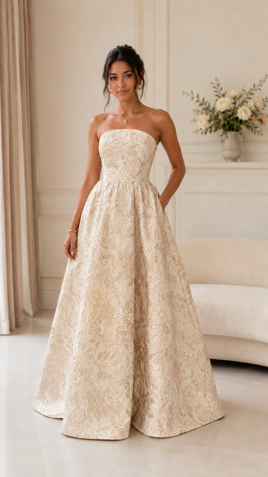 Front view of champagne strapless textured ball gown maxi dress