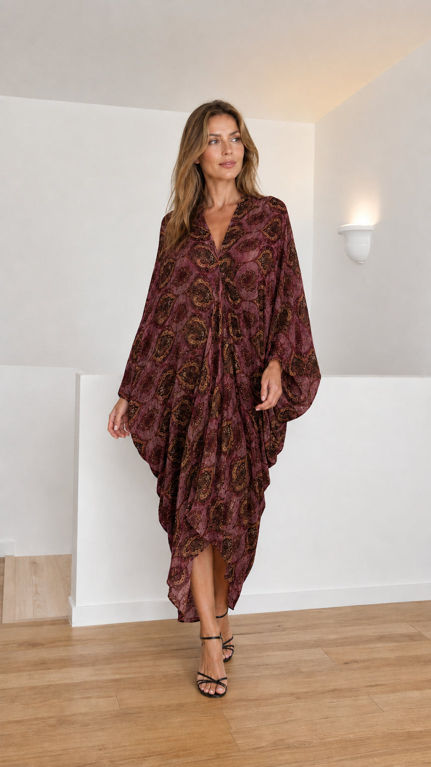 Model wearing burgundy paisley kaftan dress