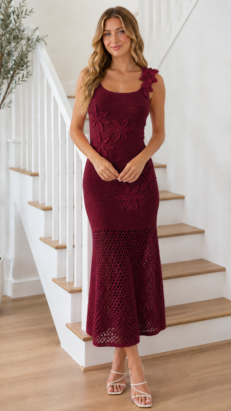 Model wearing burgundy floral appliqué knit mermaid midi dress