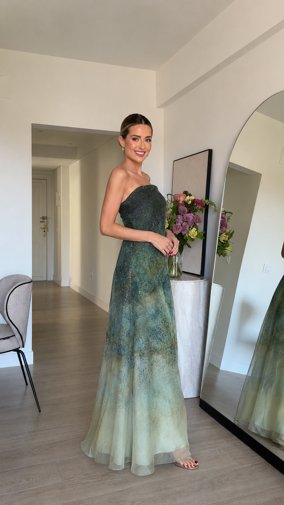Side view of sage green strapless evening gown with flowing skirt