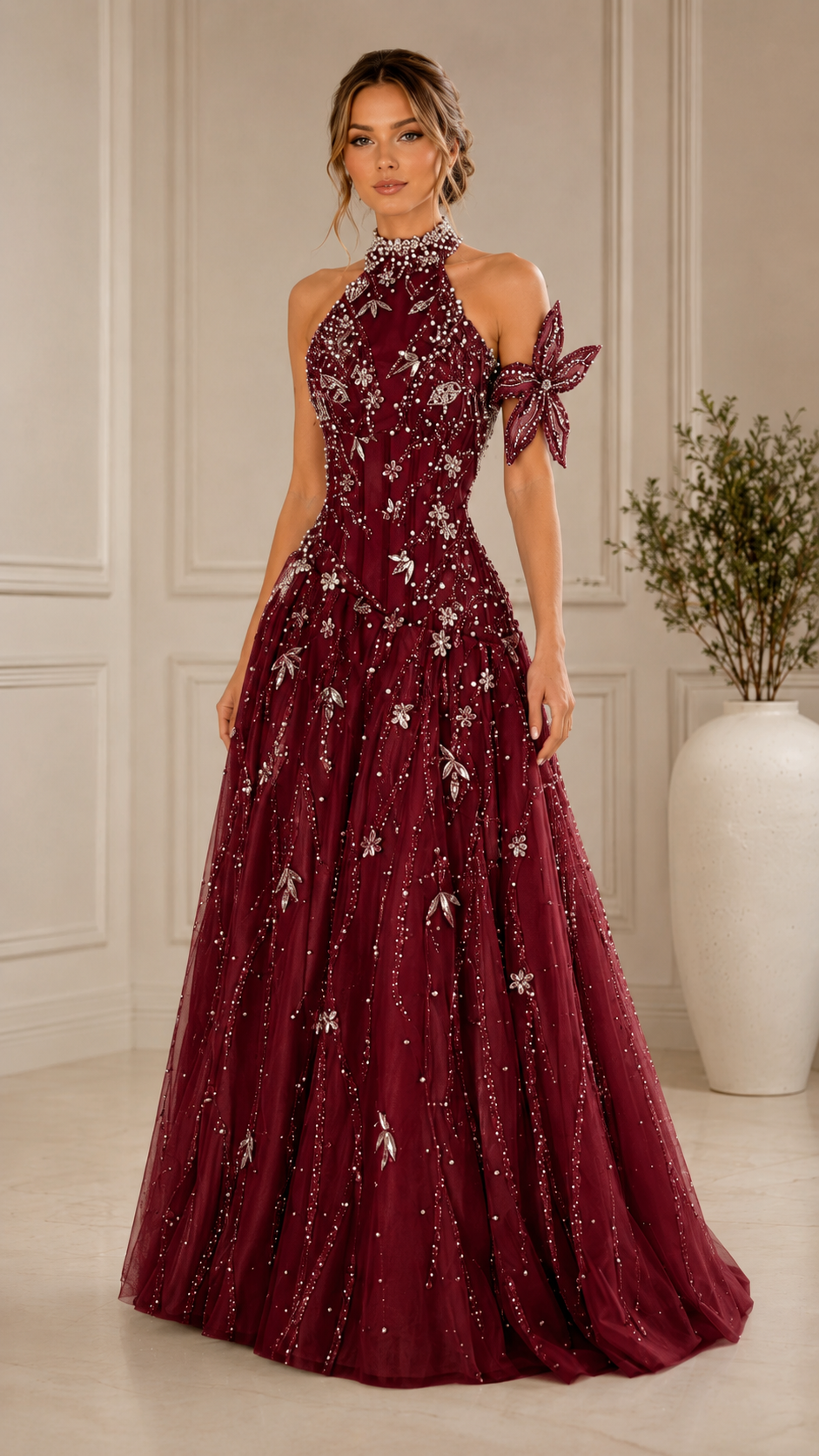 Front view of burgundy embellished halter formal gown with full skirt