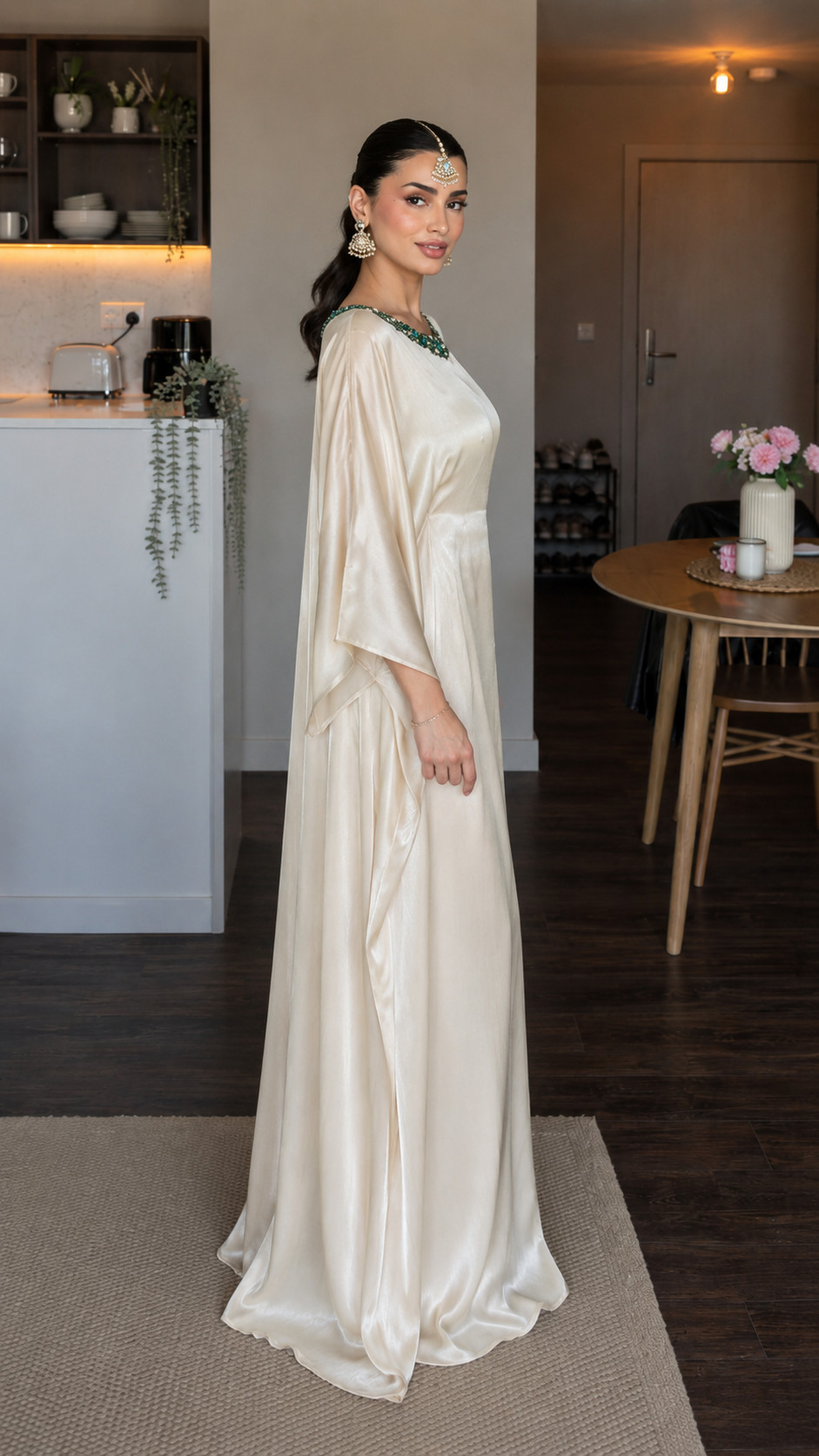 Side view of champagne satin-look maxi dress with relaxed fit and sweeping skirt