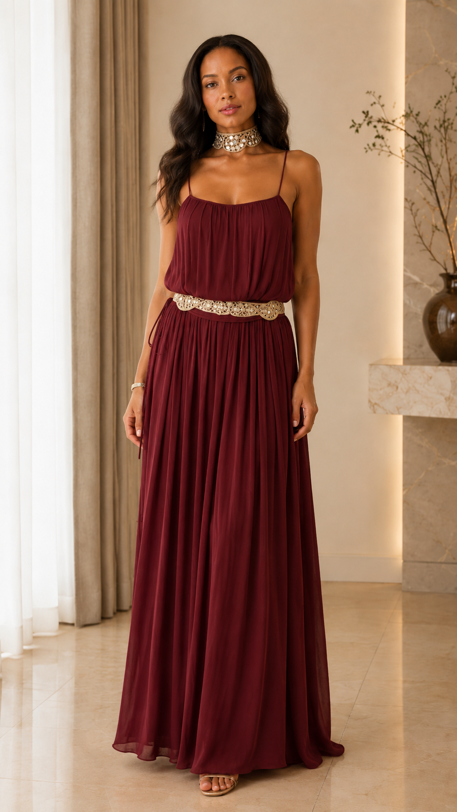 Front view of burgundy pleated maxi dress with embellished waist and maxi length
