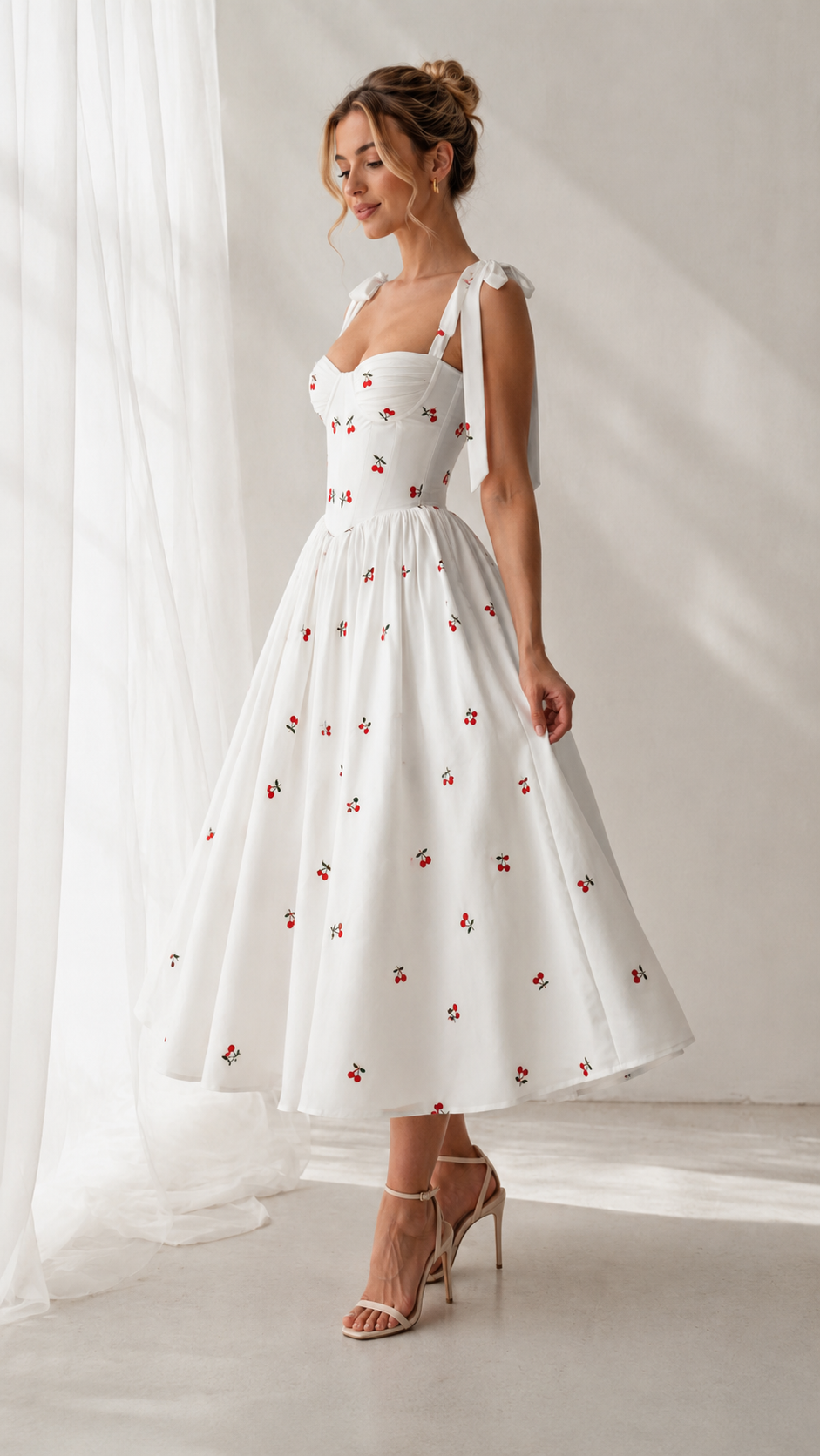 Angled front view of white cherry print fit-and-flare midi dress