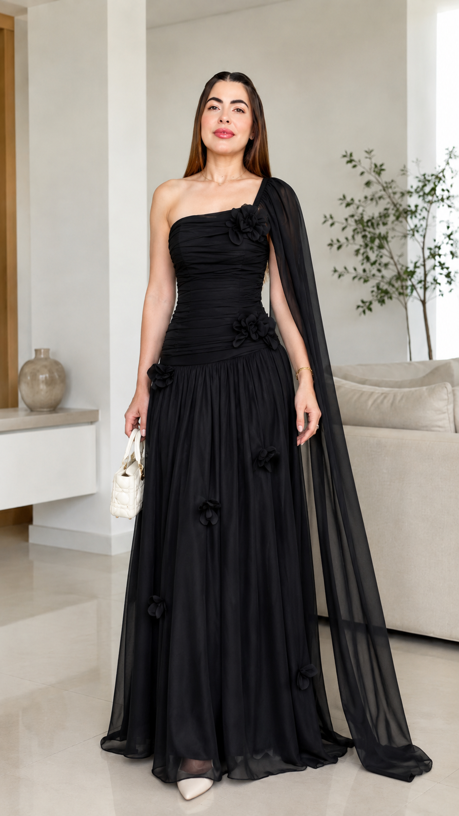 Black one-shoulder formal maxi dress with floral appliqué and flowing skirt