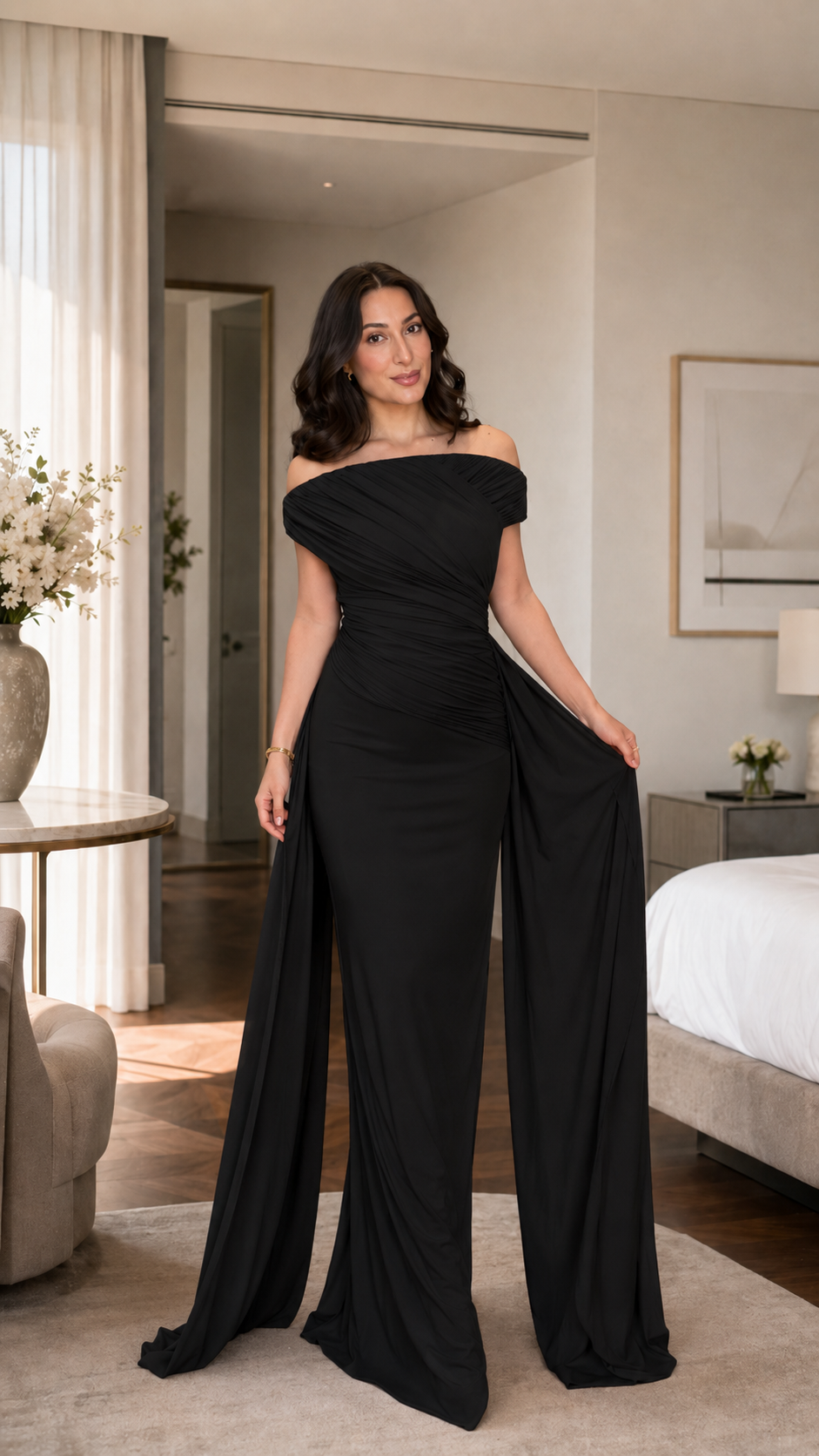 Black off shoulder formal gown with sculpted silhouette and flowing draped sleeves