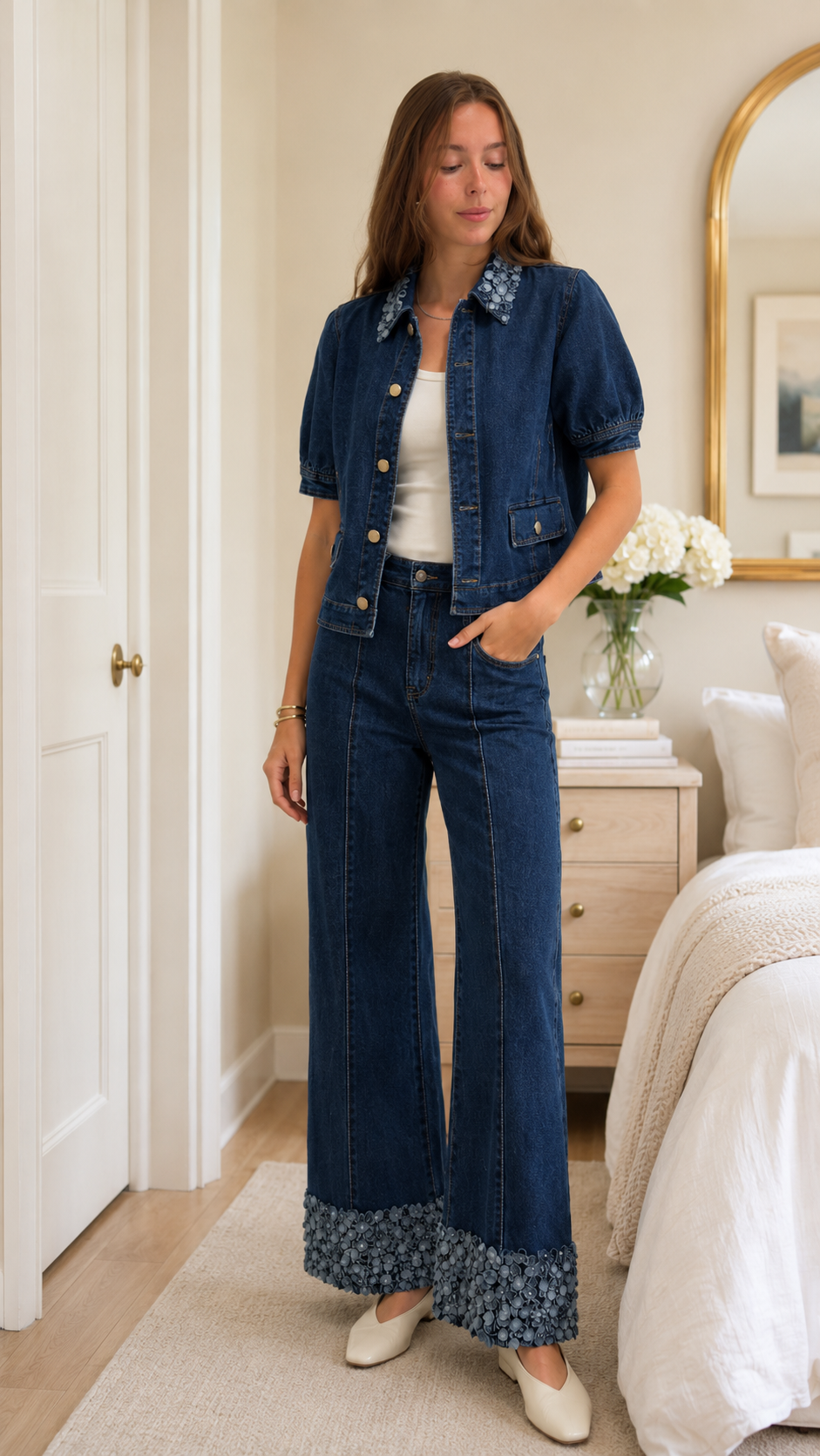 Model wearing dark wash blue matching denim set with floral trim hem