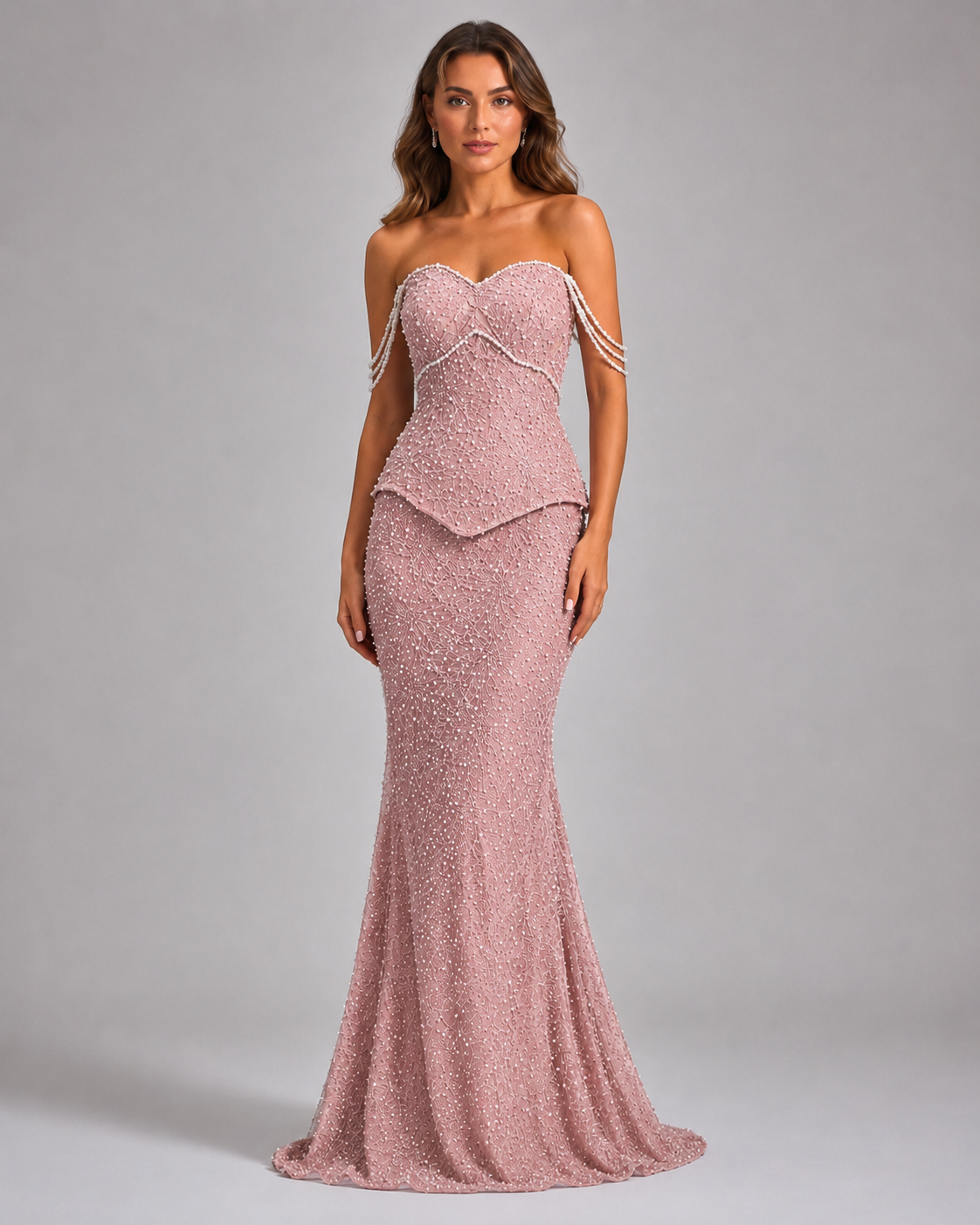 Front view of blush pink embellished mermaid formal gown