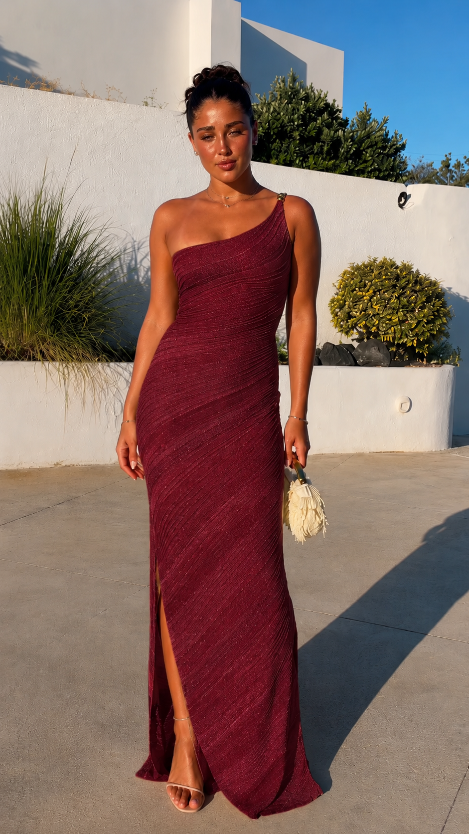 Front view of burgundy one-shoulder ruched maxi dress with slit